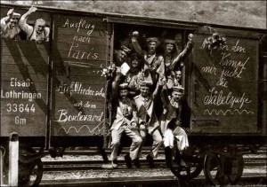 German_soldiers_in_a_railroad_car_on_the_way_to_the_front_during_early_World_War_I,_taken_in_1914._Taken_from_greatwar.nl_site
