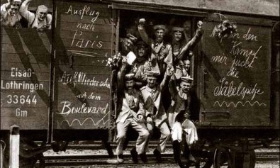 German_soldiers_in_a_railroad_car_on_the_way_to_the_front_during_early_World_War_I,_taken_in_1914._Taken_from_greatwar.nl_site